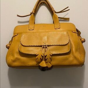 Anya Hindmarch london Designer. luggage colored tote handbag. Has 4 small stains